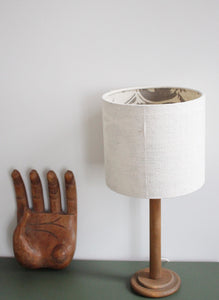 Scandi style bedside lamp. White handwoven lampshade with grey art deco style ining